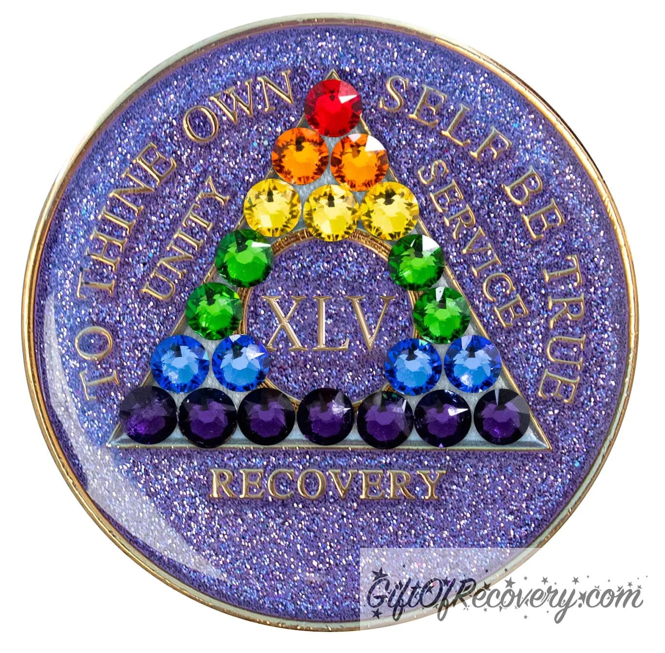 45 year AA medallion Amethyst purple glitter adorned with 21 crystals that represent the rainbow and new beginnings in the recovery journey or the LBGTQIA+ community, show your pride and your time, the AA moto and roman numeral are embossed with 14k gold-plated brass, sealed with resin for a shiny finish that will last and is scratch proof.