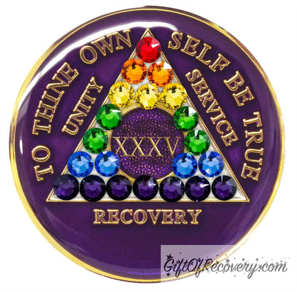 35 year AA medallion Amethyst purple, with rainbow genuine crystals as the triangle to represent the LBGTQIA+ community, show your pride, to also represent new beginnings and a love for rainbows, to thine own self be true and other AA moto is embossed 14k gold-plated brass, sealed with resin for a glossy finish that will last and is scratch proof.