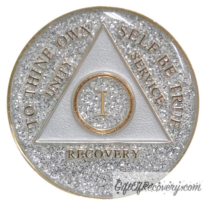 1 year AA medallion Glitter silver, always shine on in sobriety, triangle is pearl white, to thine own self be true, unity, service, recovery, and roman numeral are embossed with 14k gold-plated brass, the recovery medallion is sealed with resin for a glossy finish that will last and is scratch free.