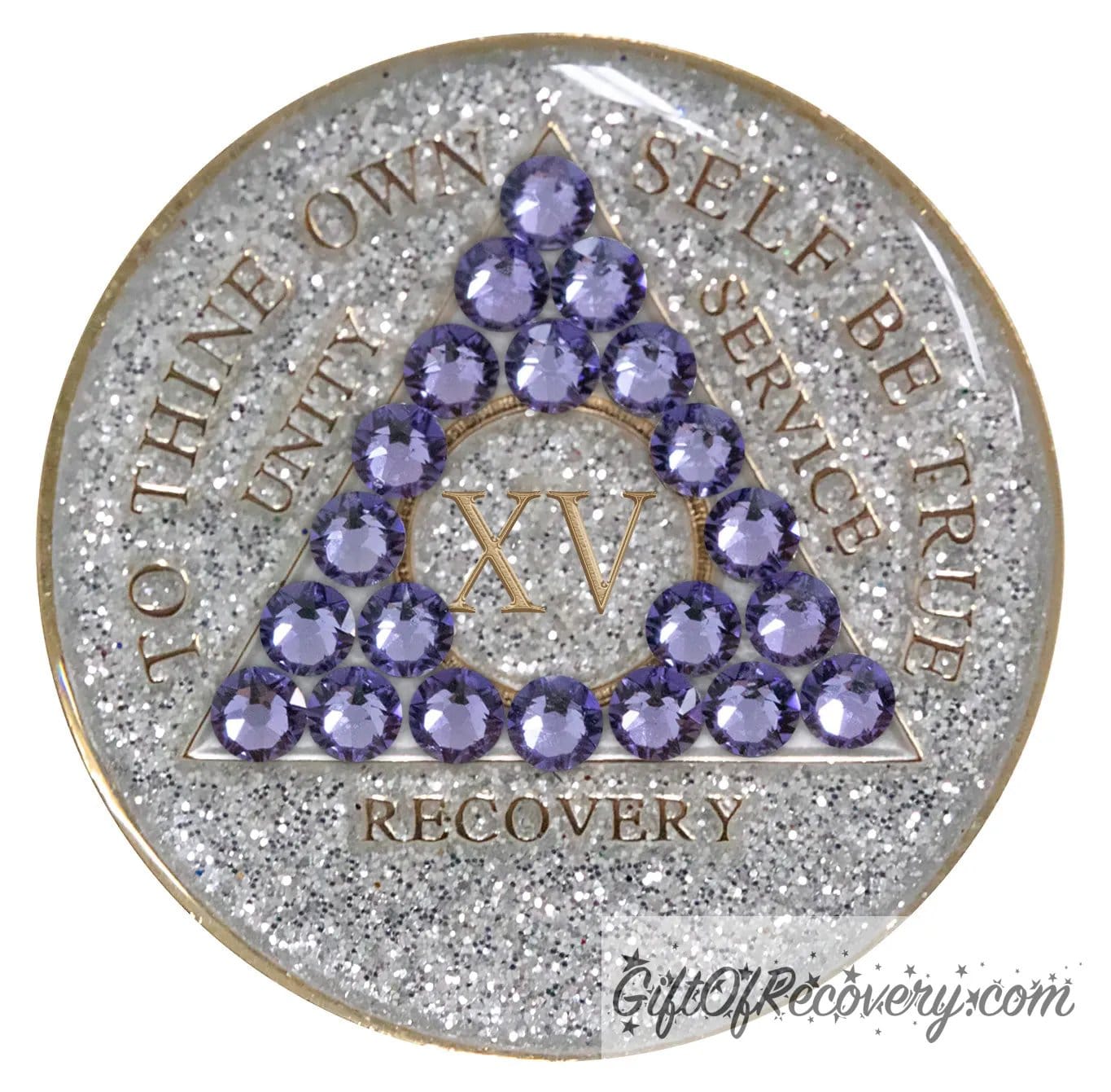 15 year AA medallion silver glitter with 21 purple genuine crystals in the shape of a triangle, to thine own self be true, unity, service, recovery, and roman numeral are embossed with 14k gold-plated brass, sealed in a high-quality, chip and scratch-resistant resin dome giving it a beautiful glossy look that will last.