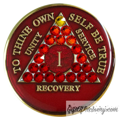 1 year AA medallion ruby red adorned with 21 genuine crystals ranging from dark red to 1 yellow crystal as a symbol of transition of growth in the program, to thine own self be true, unity, service, and recovery are embossed with 14k gold-plated brass and the recovery medallion is sealed with resin for a lasting finish.