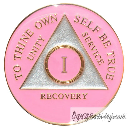 1 year AA medallion Princess pink, the ultimate girl medallion, show off your feminine side, triangle is pearl white, to thine own self be true, unity, service, recovery, and roman numeral are embossed with 14k gold-plated brass, the recovery medallion is sealed with resin for a glossy finish that will last and is scratch free.