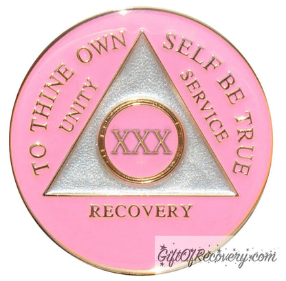 30 year AA medallion Princess pink, the ultimate girl medallion, show off your feminine side, triangle is pearl white, to thine own self be true, unity, service, recovery, and roman numeral are embossed with 14k gold-plated brass, the recovery medallion is sealed with resin for a glossy finish that will last and is scratch free.