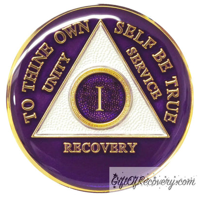 1 year AA medallion Amethyst purple, recovery is possible, triangle is pearl white, to thine own self be true, unity, service, recovery, and roman numeral are embossed with 14k gold-plated brass, the recovery medallion is sealed with resin for a glossy finish that will last and is scratch free.