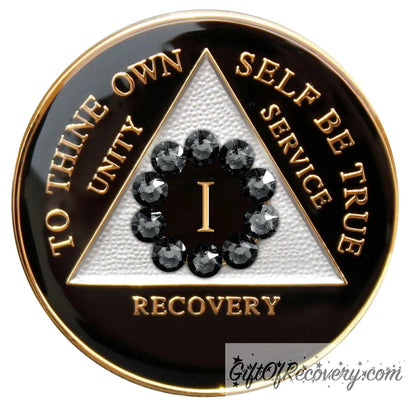 1 Year AA medallion black onyx with white triangle and 10 genuine black crystals around the number to symbolize our unity in the program, AA moto and 3 legacies are embossed with 14k gold-plated brass and it is sealed with resin for a glossy finish.