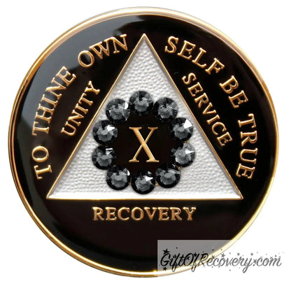 10 Year AA medallion black onyx with white triangle and 10 genuine black crystals around the number to symbolize our unity in the program, AA moto and 3 legacies are embossed with 14k gold-plated brass and it is sealed with resin for a glossy finish.