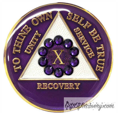 10 year AA medallion purple amethyst, adorned with 10 genuine purple crystals in a circle around the roman numeral to symbolize unity in the program, the triangle is pearl white and the AA moto is embossed with 14k gold-plated brass, sealed with resin for a shiny finish that will last and scratch proof.