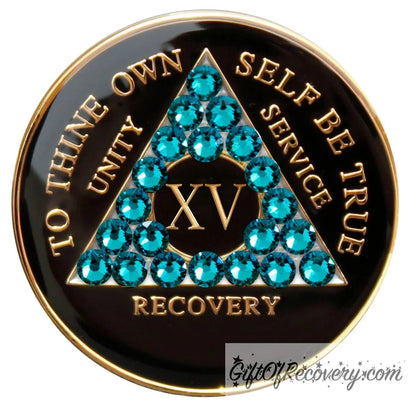 Recovery Medallion 15 Year Black Onyx with twenty-one Blue zircon crystals in the shape of the triangle, with to thine own self be true, roman numeral, and unity, service, recovery embossed with 14k Gold-plated brass and sealed with resin for a glossy shine that is scratch resistant.