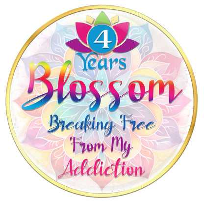 4 year Lotus blossom recovery medallion with vibrant colors of blue, pink, purple, red, and yellow in each pedal of the flower in a silhouette background that matches the front of the medallion, the year and words breaking free of my addictions in the colors of the blossom.